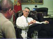 Captain Connors briefs Secretary of the Navy Danzig on the LIFELines Initiative